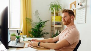 Young Man Working In A Home Office