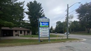 A sign in front of Lakeland headquarters, featuring a digital display that reads "Ultra-fast Fibre Internet is here."