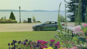 A Lakeland Networks vehicle by the shore of Lake of Bays