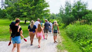 People walking down a path in a park
